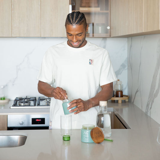 A man mixing greens powder